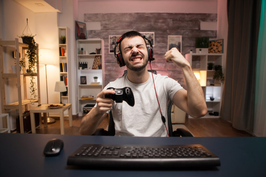 Happy person after winning in video game